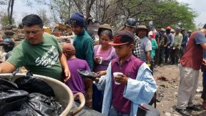 Rafael serves lunches to the garbage dump workers: Charity