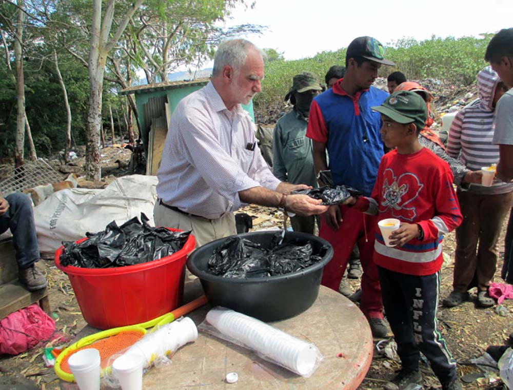 Don Julio and his wife receiving groceries