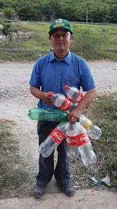 Charities: Rafael's neighbor, Darwin, with the plastic bottles he collects. Charities