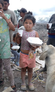 Charity: a dirty little girl at the dump