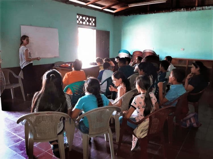 Volunteer teaching English to children